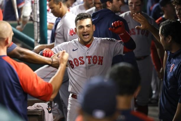 Jose Iglesias of the Boston Red Sox celebrates in the dugout after scoring against the Washington Nationals in the ninth inning at Nationals Park on...