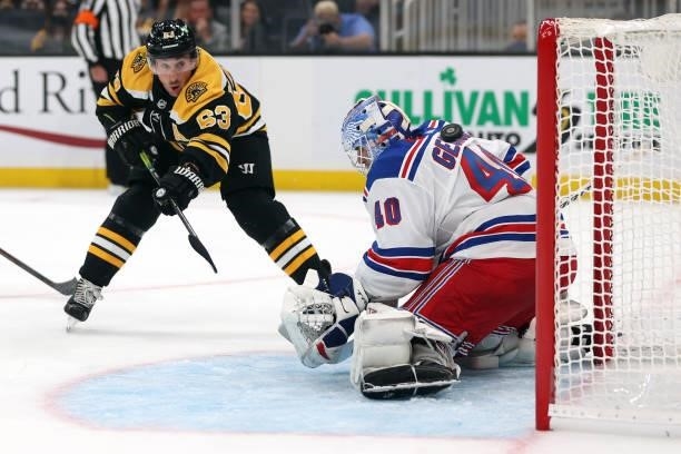 Brad Marchand of the Boston Bruins scores a goal against Alexandar Georgiev of the New York Rangers during the first period of the preseason game at...