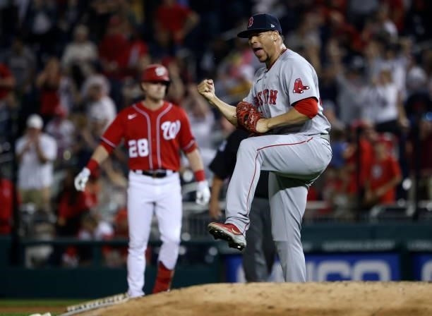 Hansel Robles of the Boston Red Sox celebrates after the Red Sox defeated the Washington Nationals 5-3 at Nationals Park on October 02, 2021 in...