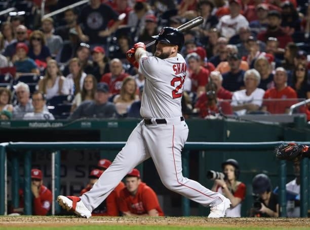 Travis Shaw of the Boston Red Sox connects for a RBI single against the Washington Nationals in the ninth inning at Nationals Park on October 02,...