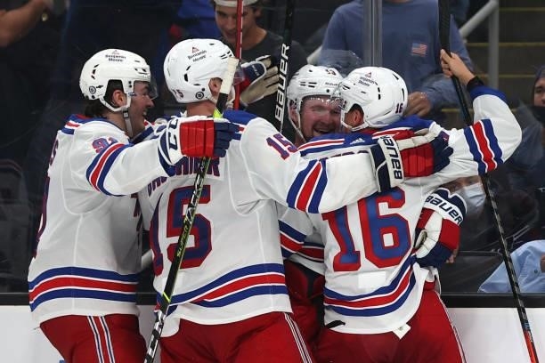 Alexis Lafrenière of the New York Rangers celebrates with Ryan Strome Julien Gauthier and Sammy Blais after scoring a goal during overtime to win the...