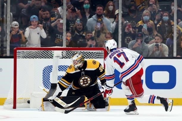 Kevin Rooney of the New York Rangers scores a goal against Linus Ullmark of the Boston Bruins during overtime of the preseason game at TD Garden on...
