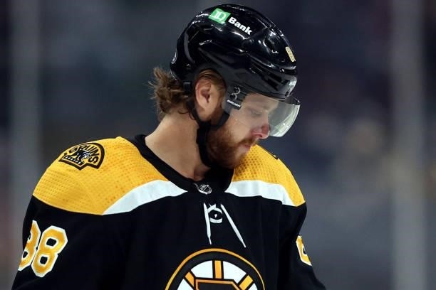 David Pastrnak of the Boston Bruins looks on during the first period of the preseason game against the New York Rangers at TD Garden on October 02,...