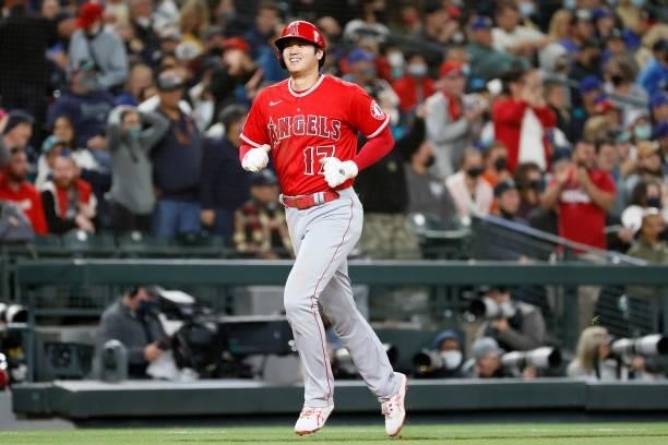 Shohei Ohtani of the Los Angeles Angels scores on a three-run home run by Jared Walsh during the eighth inning against the Seattle Mariners at...