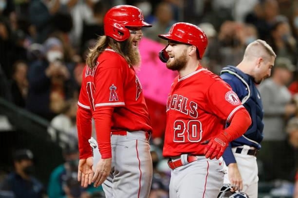 Jared Walsh of the Los Angeles Angels celebrates with Brandon Marsh after hitting a three-run home run during the eighth inning against the Seattle...