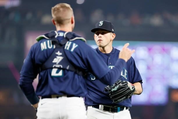 Tom Murphy and Chris Flexen of the Seattle Mariners react after an out against the Los Angeles Angels at T-Mobile Park on October 02, 2021 in...