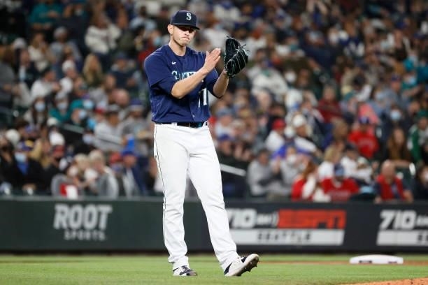 Chris Flexen of the Seattle Mariners reacts after a play against the Los Angeles Angels at T-Mobile Park on October 02, 2021 in Seattle, Washington.