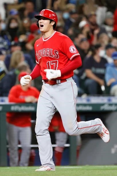 Shohei Ohtani of the Los Angeles Angels scores on a three run home run by Jared Walsh during the eighth inning against the Seattle Mariners at...