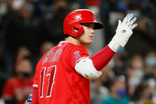 Shohei Ohtani of the Los Angeles Angels reacts during the game against the Seattle Mariners at T-Mobile Park on October 02, 2021 in Seattle,...