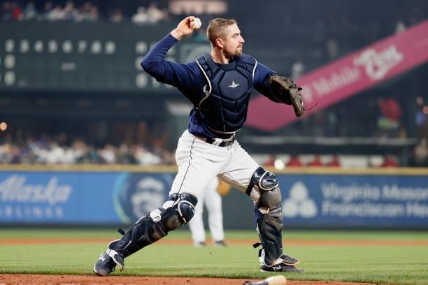 Tom Murphy of the Seattle Mariners makes a play against the Los Angeles Angels at T-Mobile Park on October 02, 2021 in Seattle, Washington.