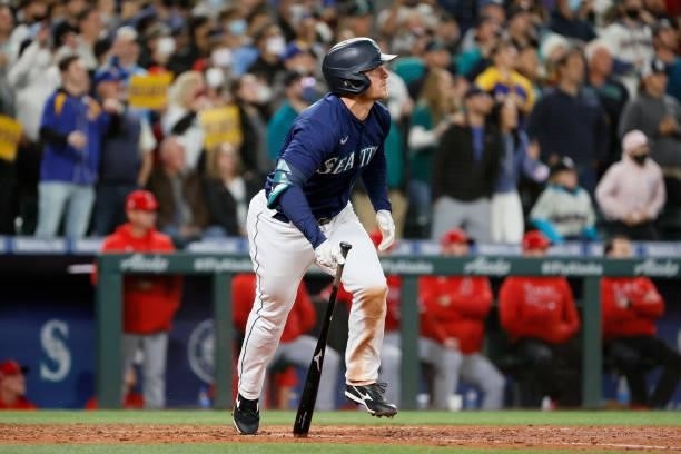 Kyle Seager of the Seattle Mariners watches his RBI single during the eighth inning against the Los Angeles Angels at T-Mobile Park on October 02,...