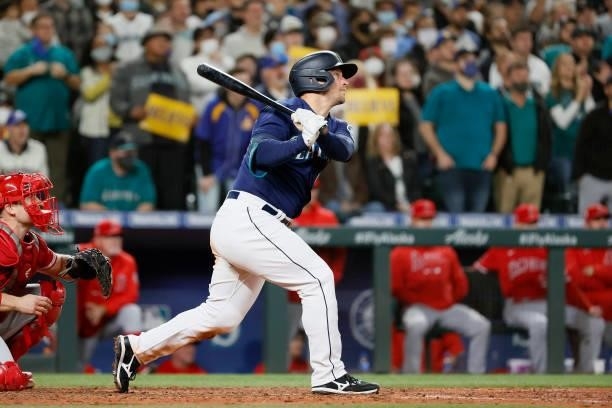 Kyle Seager of the Seattle Mariners watches his RBI single during the eighth inning against the Los Angeles Angels at T-Mobile Park on October 02,...
