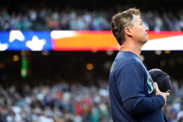 Manager Scott Servais of the Seattle Mariners stands for the national anthem before the game against the Los Angeles Angels at T-Mobile Park on...