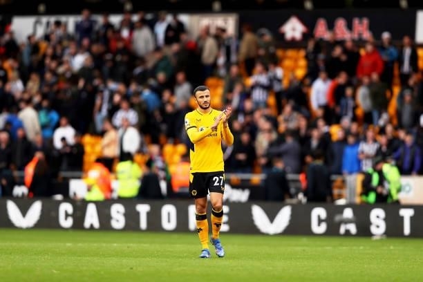 Romain Saiss of Wolverhampton Wanderers shows appreciation to the fans following victory in the Premier League match between Wolverhampton Wanderers...