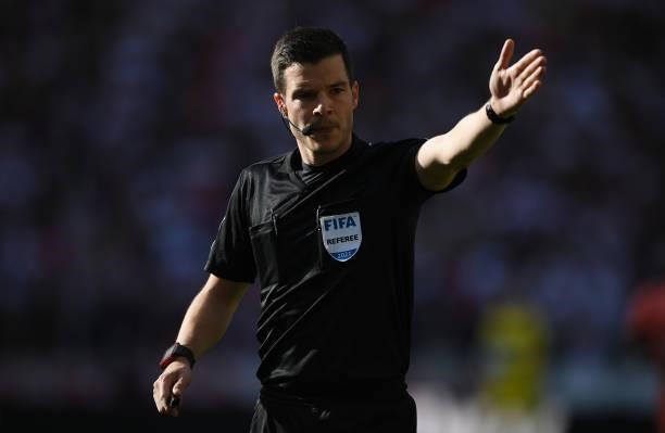 Referee Harm Osmers gestures during the Bundesliga match between VfB Stuttgart and TSG Hoffenheim at Mercedes-Benz Arena on October 02, 2021 in...