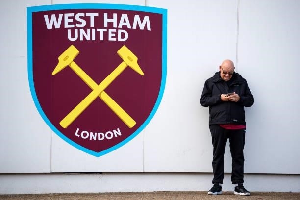 View of a fan outside London Stadium prior to the Premier League match between West Ham United and Brentford at London Stadium on October 03, 2021 in...