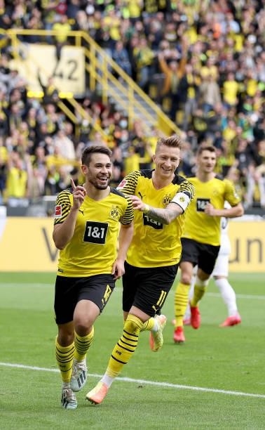 Raphael Guerreiro of Dortmund celebrates after scoring his teams first goal during the Bundesliga match between Borussia Dortmund and FC Augsburg at...