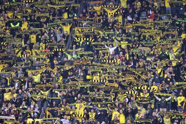 Fans of Dortmund are seen during the Bundesliga match between Borussia Dortmund and FC Augsburg at Signal Iduna Park on October 02, 2021 in Dortmund,...