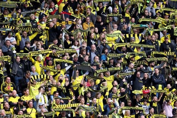 Fans of Dortmund are seen during the Bundesliga match between Borussia Dortmund and FC Augsburg at Signal Iduna Park on October 02, 2021 in Dortmund,...