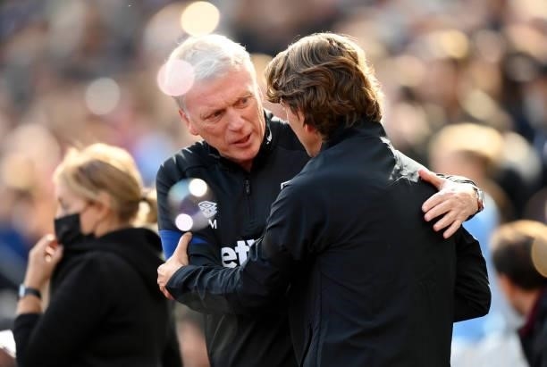 David Moyes, Manager of West Ham United embraces Thomas Frank, Manager of Brentford ahead of the Premier League match between West Ham United and...