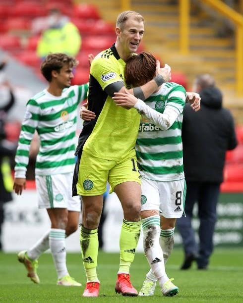 Joe Hart and Kyogo Furuhashi of Celtic celebrates their side's victory after the Ladbrokes Scottish Premiership match between Aberdeen and Celtic at...