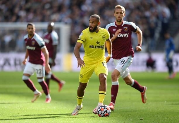 Bryan Mbeumo of Brentford runs with the ball during the Premier League match between West Ham United and Brentford at London Stadium on October 03,...