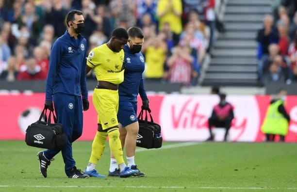 Shandon Baptiste of Brentford is taken off injured during the Premier League match between West Ham United and Brentford at London Stadium on October...