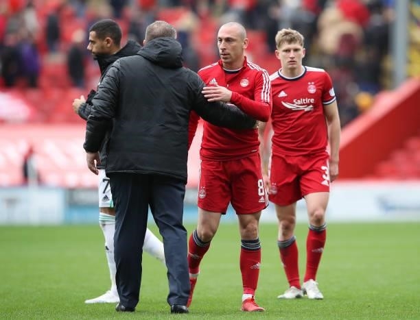 Ange Postecoglou and Scott Brown are seen during the Ladbrokes Scottish Premiership match between Aberdeen and Celtic at Pittodrie Stadium on October...