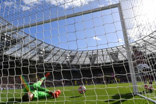 Lukasz Fabianski of West Ham United concedes the opening goal of the game scored by Bryan Mbeumo of Brentford during the Premier League match between...