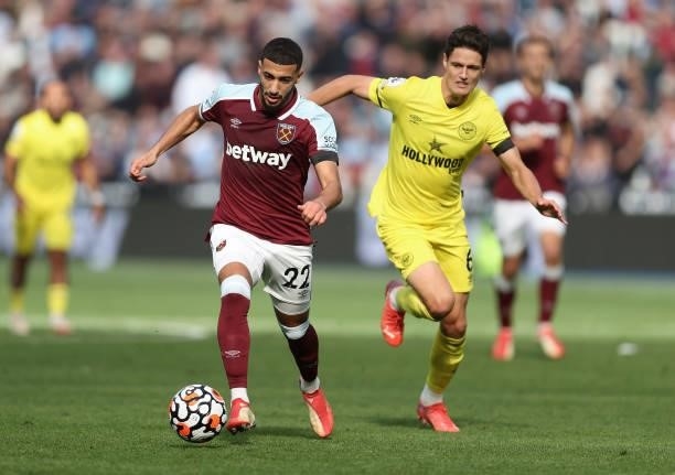 Said Benrahma of West Ham United with Christian Norgaard of Brentford during the Premier League match between West Ham United and Brentford at London...