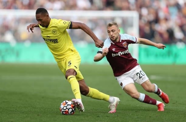 Ethan Pinnock of Brentford with Jarrod Bowen of West Ham United during the Premier League match between West Ham United and Brentford at London...