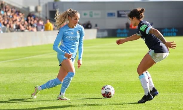 Janine Beckie of Manchester City Women takes on Zaneta Wyne of West Ham United Women during the Barclays FA Women's Super League match between...