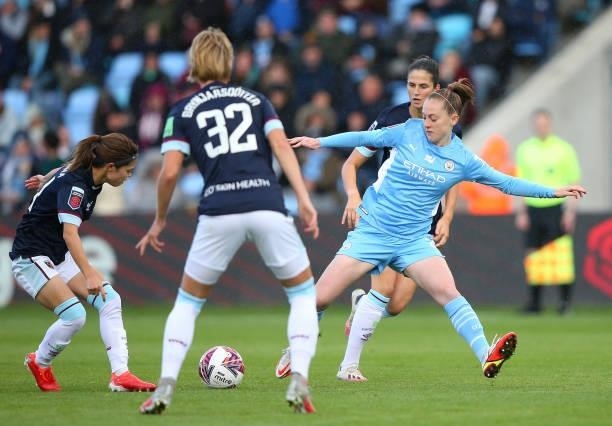 Keira Walsh of Manchester City Women is challenged by Yui Hasegawa of West Ham United Women during the Barclays FA Women's Super League match between...