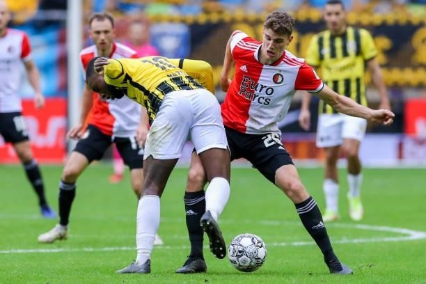 Riechedly Bazoer of Vitesse, Guus Til of Feyenoord during the Dutch Eredivisie match between Vitesse and Feyenoord at Gelredome on October 3, 2021 in...