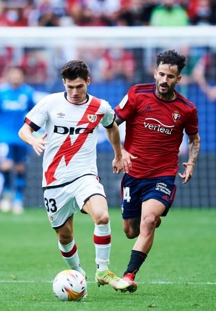 Ruben Garcia of CA Osasuna duels for the ball with Fran Garcia of Rayo Vallecano during the La Liga Santander match between CA Osasuna and Rayo...