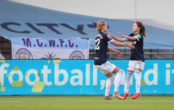 Dagny Brynjarsdottir of West Ham United Women celebrates with Yui Hasegawa after scoring the opening goal during the Barclays FA Women's Super League...