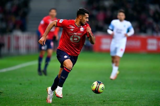 Zeki Celik of Lille OSC runs with the ball during the Ligue 1 Uber Eats match between Lille and Marseille at Stade Pierre Mauroy on October 03, 2021...
