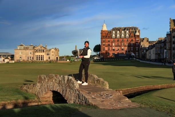 Danny Willett of England poses with the trophy on the Swilcan Bridge after the final round of The Alfred Dunhill Links Championship on The Old Course...