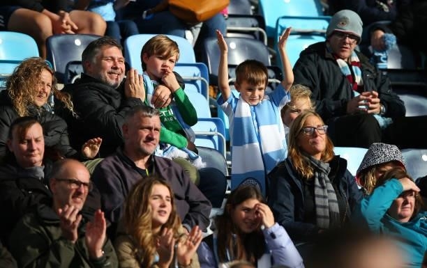 Young fan of Manchester City Women shows his support during the Barclays FA Women's Super League match between Manchester City Women and West Ham...