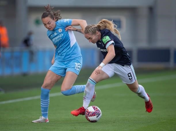 Caroline Weir of Manchester City and Claudia Walker of West Ham United in action during the Barclays FA Women's Super League match between Manchester...
