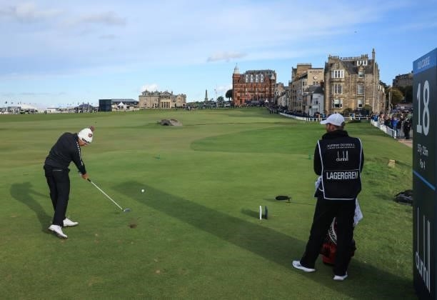 Daniel Gavins of England embraces his amateur playing partner Bob Diamond on the 18th hole during the final round of The Alfred Dunhill Links...