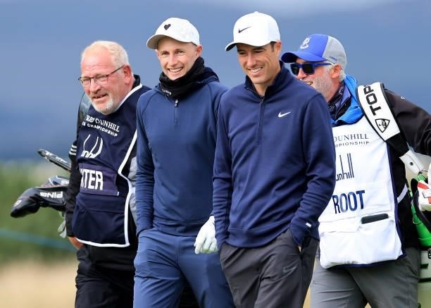 Ross Fisher of England with his amateur partner Joe Root on the 15th hole during the final round of The Alfred Dunhill Links Championship on The Old...