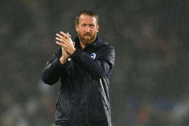 Brighton manager Graham Potter applauds the fans in the rain at the end of the Premier League match between Brighton & Hove Albion and Arsenal at...