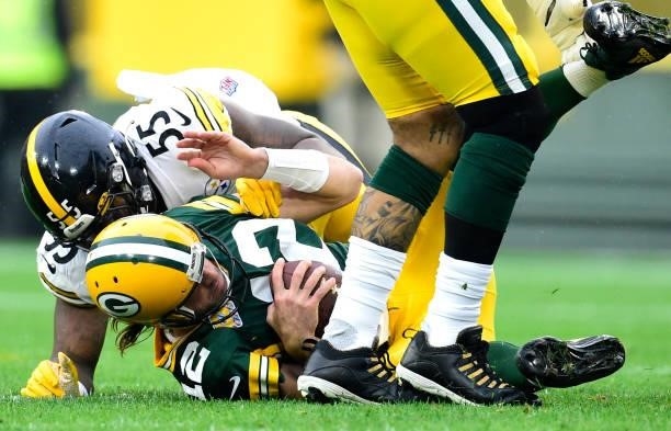 Aaron Rodgers of the Green Bay Packers is sacked by Devin Bush of the Pittsburgh Steelers during the first quarter at Lambeau Field on October 03,...