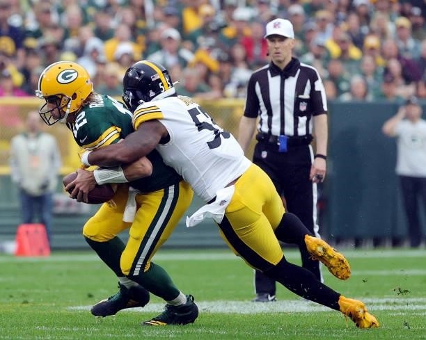 Aaron Rodgers of the Green Bay Packers is sacked by Devin Bush of the Pittsburgh Steelers during the first quarter at Lambeau Field on October 03,...