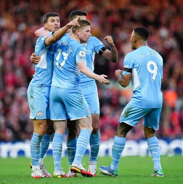 Kevin de Bruyne of Manchester City celebrates with teammates after scoring his teams second goal during the Premier League match between Liverpool...