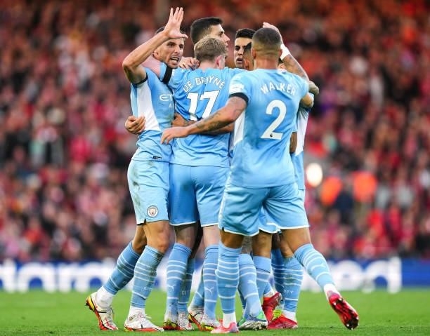 Kevin de Bruyne of Manchester City celebrates with teammates after scoring his teams second goal during the Premier League match between Liverpool...