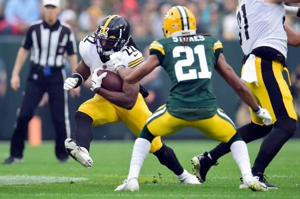 Najee Harris of the Pittsburgh Steelers runs the ball during the first quarter against the Green Bay Packers at Lambeau Field on October 03, 2021 in...