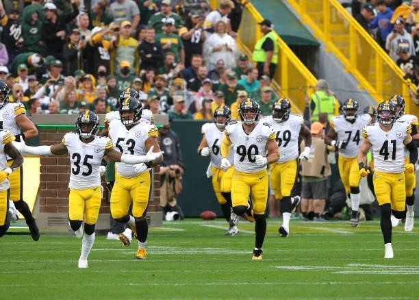 The Pittsburgh Steelers take the field before the game against the Green Bay Packers at Lambeau Field on October 03, 2021 in Green Bay, Wisconsin.