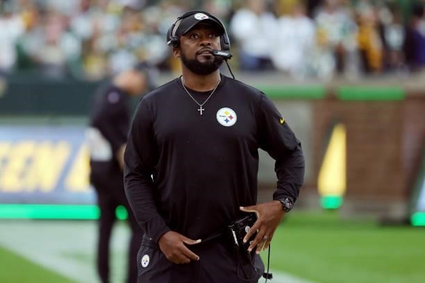 Head coach Mike Tomlin of the Pittsburgh Steelers looks on during the game against the Green Bay Packers at Lambeau Field on October 03, 2021 in...